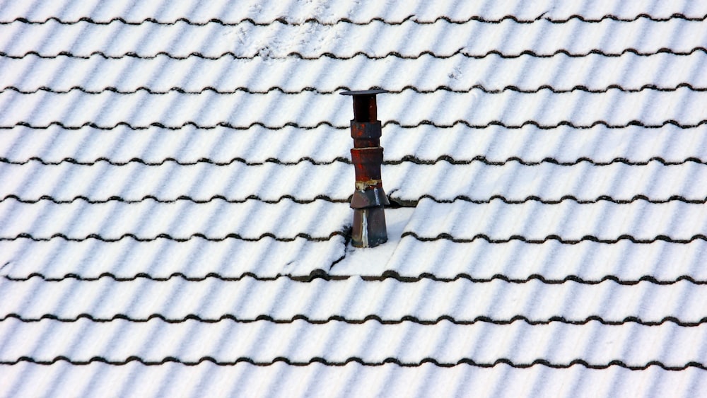 brown post on roof