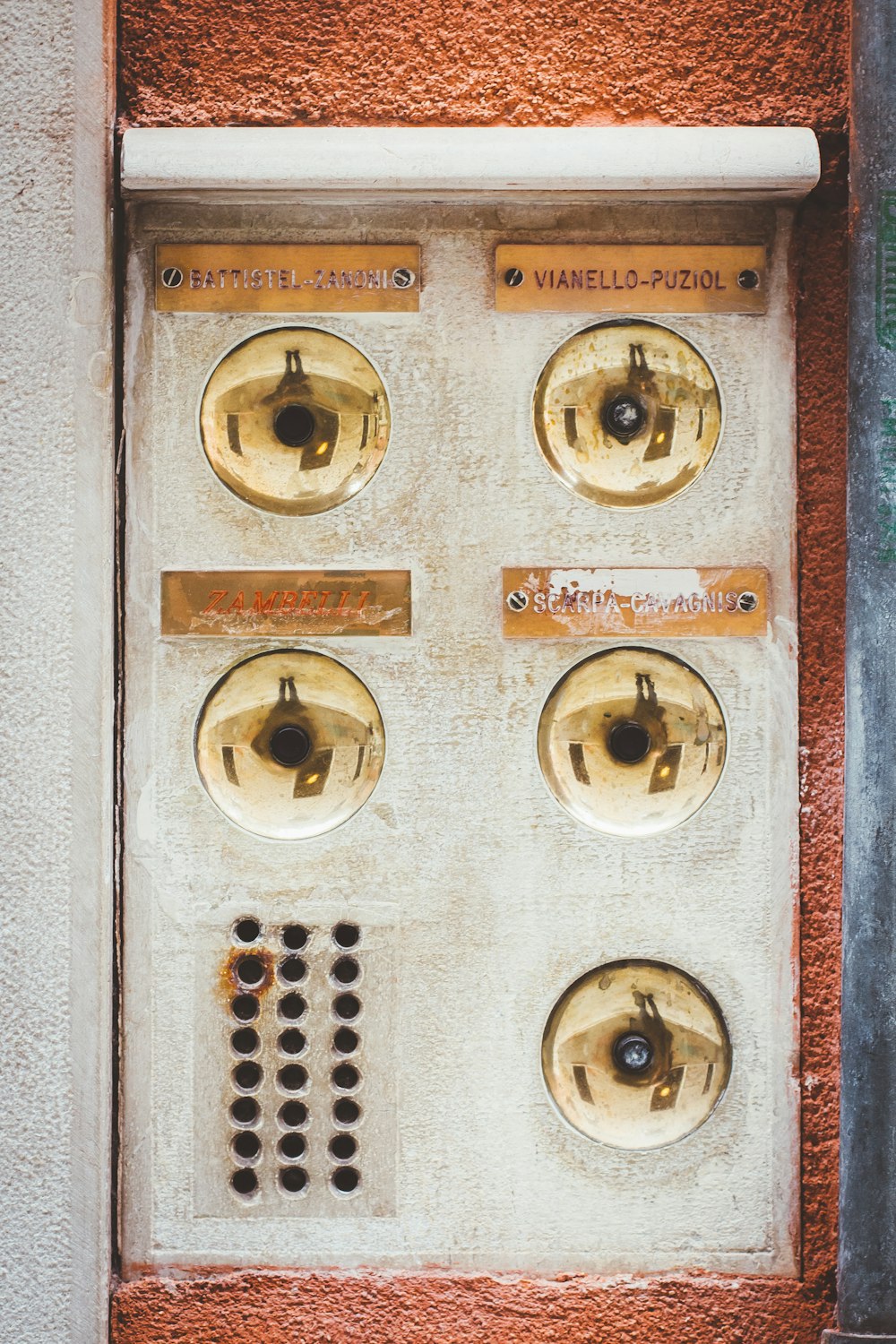 a door with a bunch of knobs on it