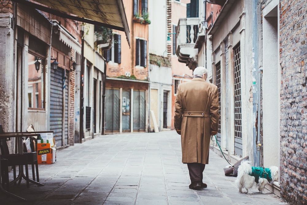 man walking on alley