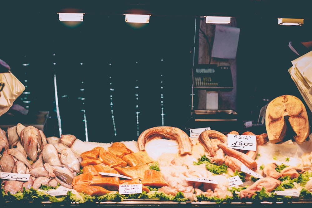 a shelf of meat grocers