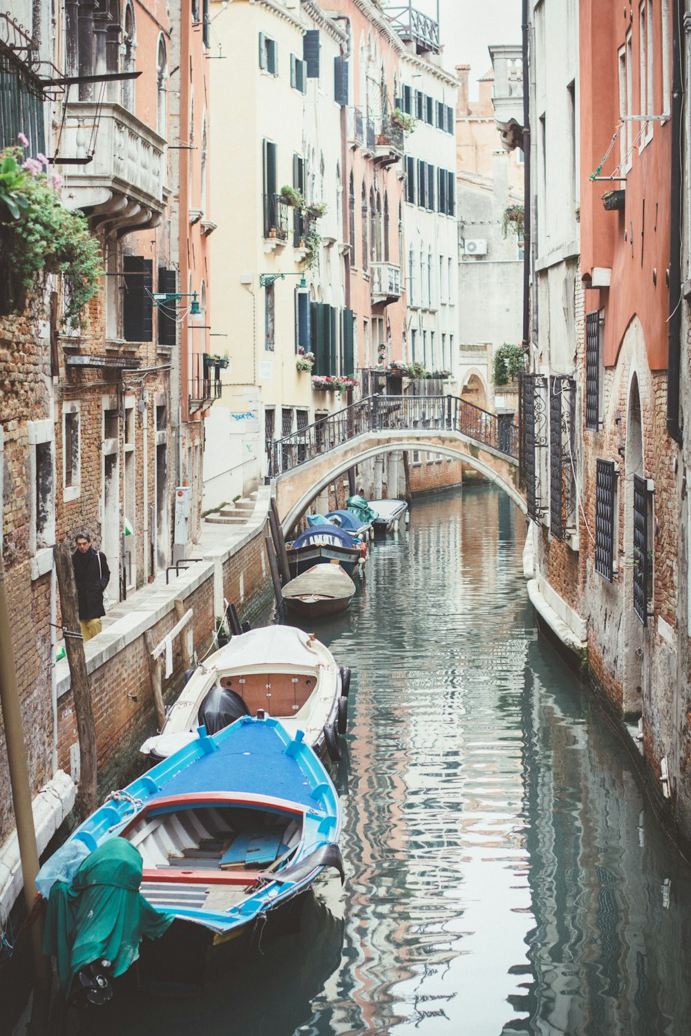 a canal with several small boats in it