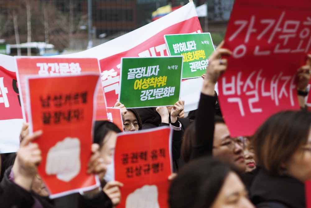 people on rally raising posters