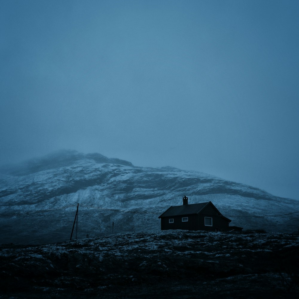 black house near mountain