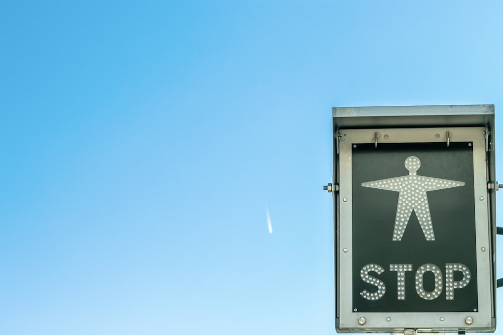 white and green Stop signage