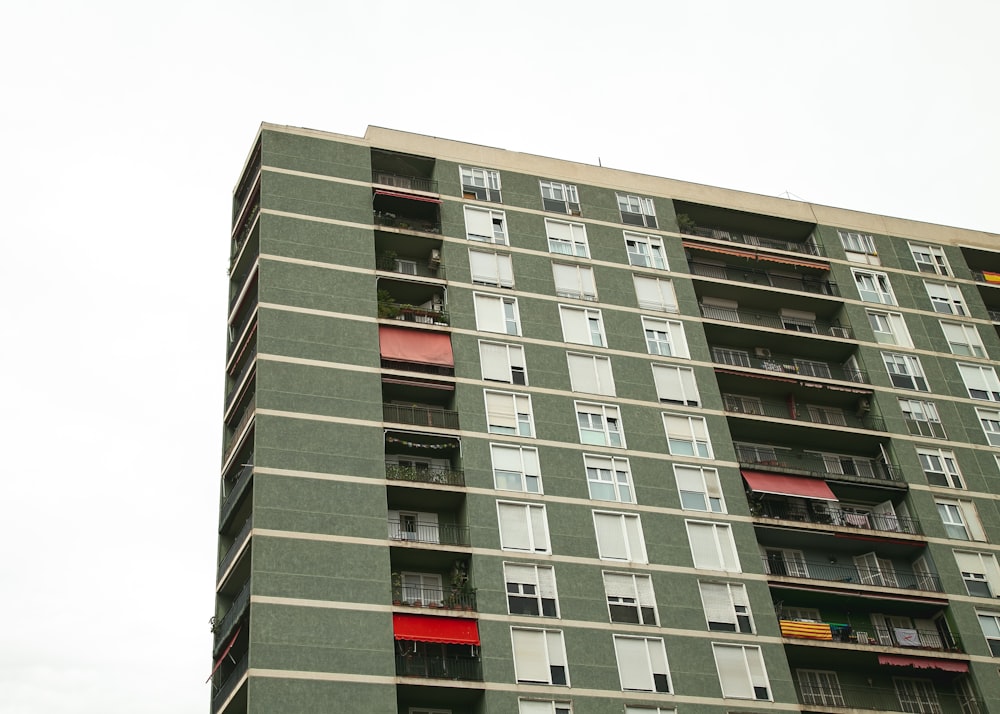 low-angle photography of gray concrete multi-story building during daytime