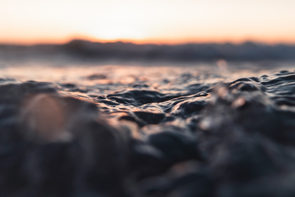 a blurry photo of the ocean at sunset