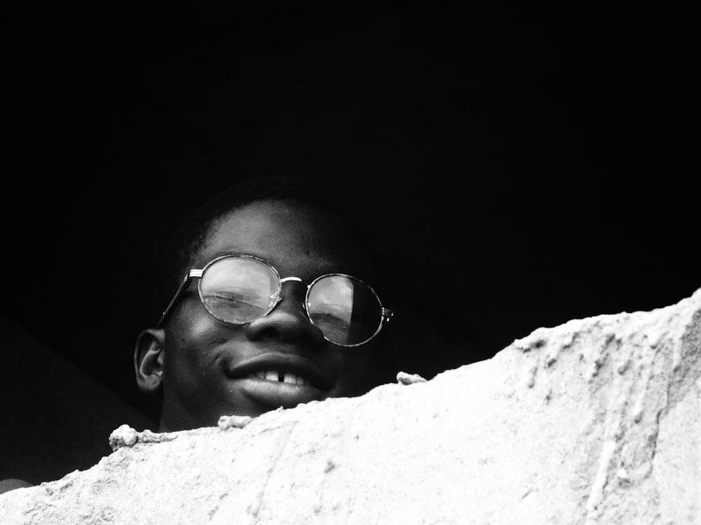 grayscale photo of man wearing eyeglasses