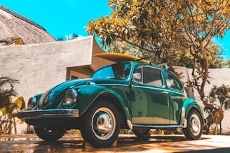 parked blue Volkswagen coupe