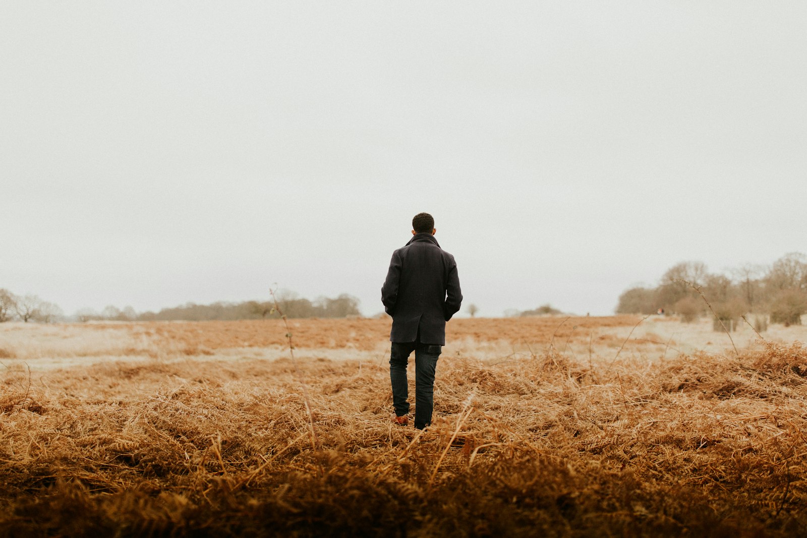 Canon EOS 5D Mark III + Canon EF 35mm F1.4L II USM sample photo. Man walking on brown photography