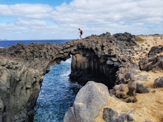 man standing on cliff