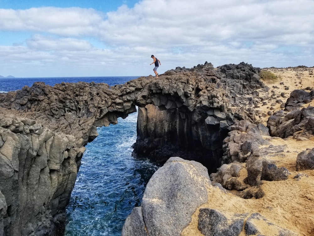 man standing on cliff