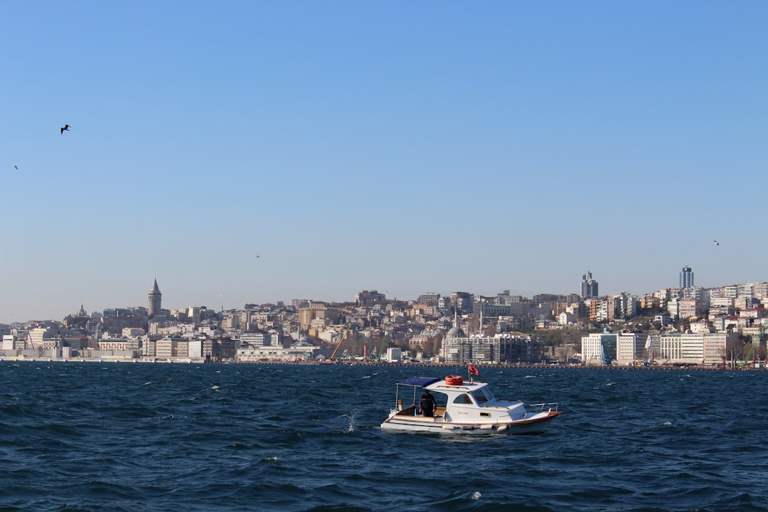 whit motorboat on calm body of water