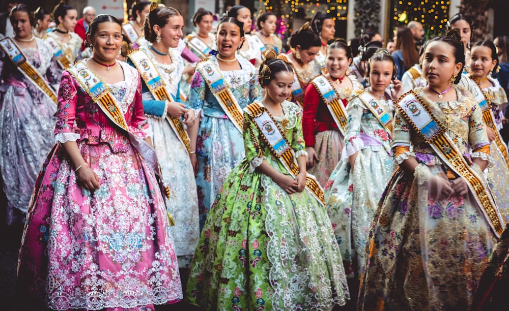 women wearing dress with sash during daytime