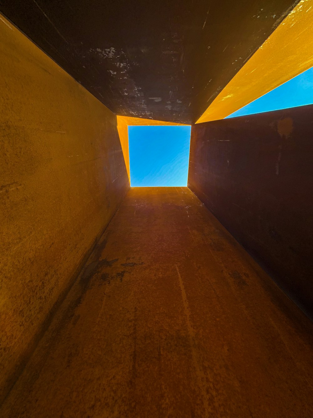 low angle photo on concrete building under blue sky