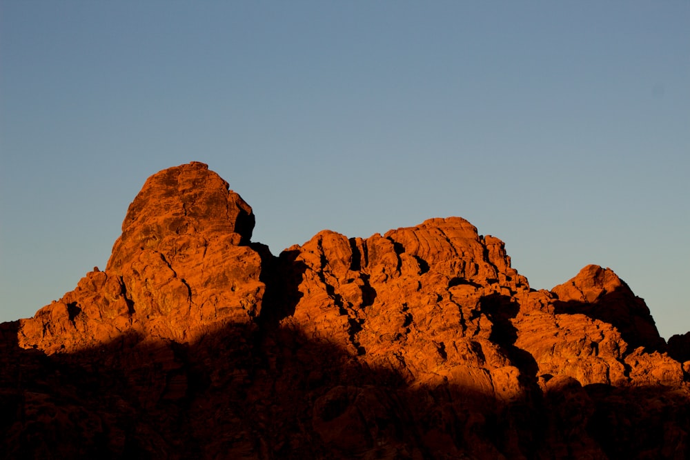 brown rock formation under blue sky during daytime