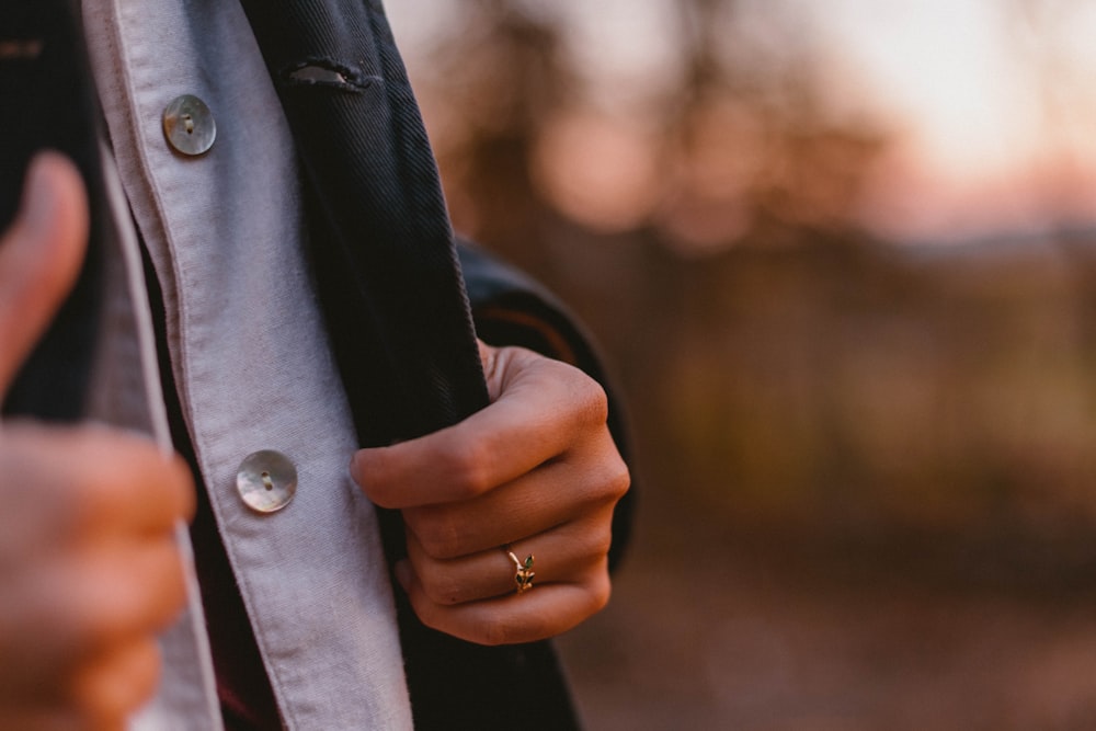 person touching blazer