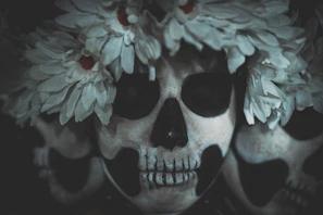 Close-up of a colorful hand-painted catrina with intricate floral patterns