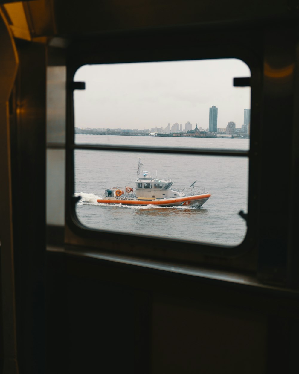 white and orange boat