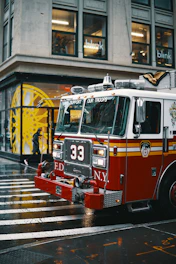 shallow focus photo of white and red firetruck