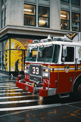 Water damage restoration truck parked outside a Queens property ready for emergency response.