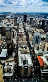 Aerial view of a bustling city with various properties.