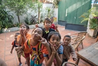 group of children taking photo together outside