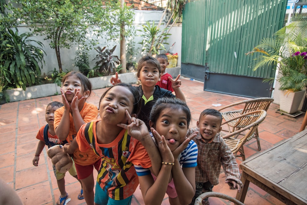 group of children taking photo together outside