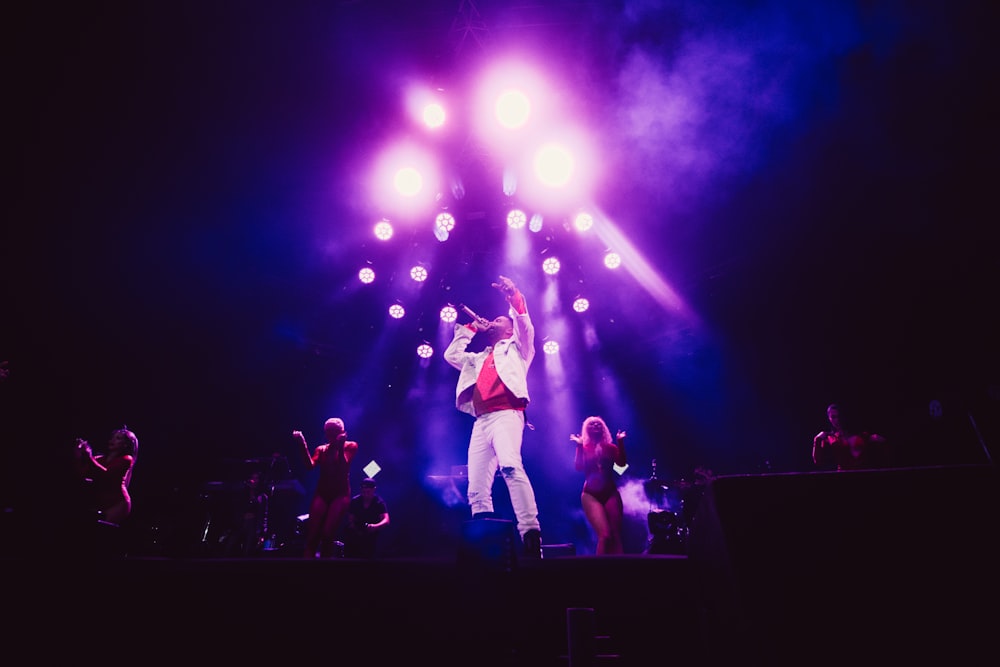 man playing song on the stage