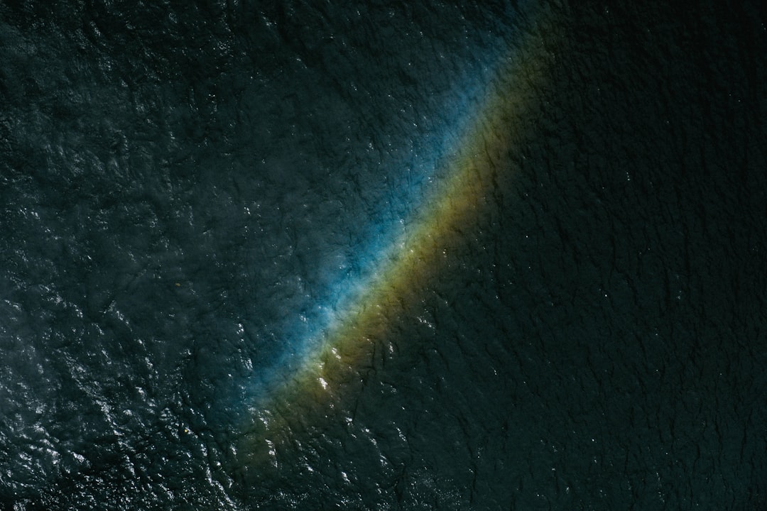 rainbow reflected on sea