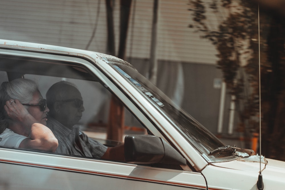 man and woman in vehicle