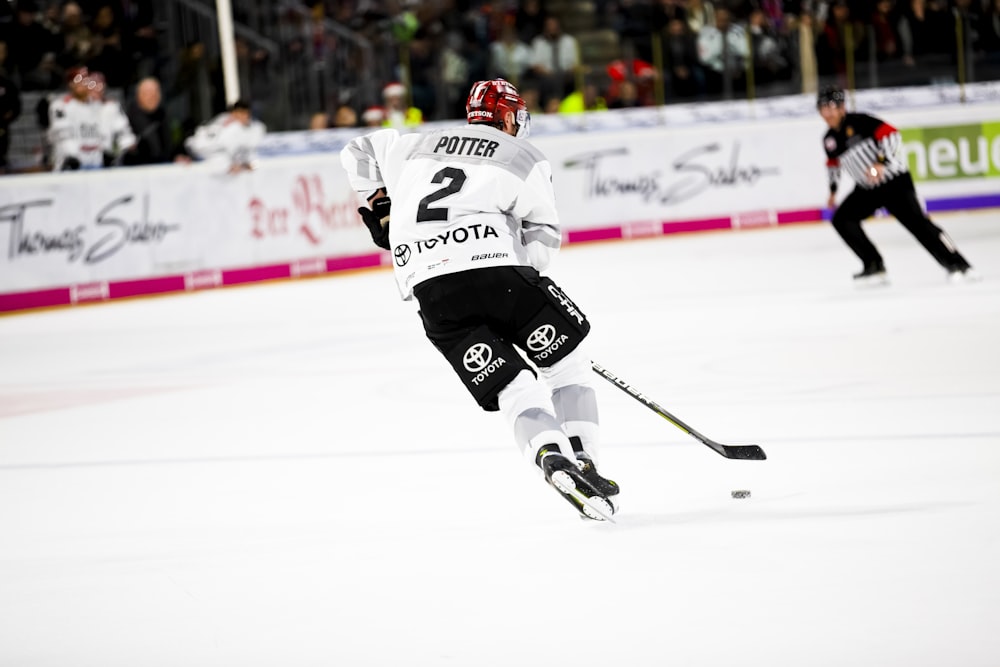 man playing ice hockey on the field