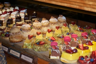 A display of assorted pastries such as eclairs and danishes.