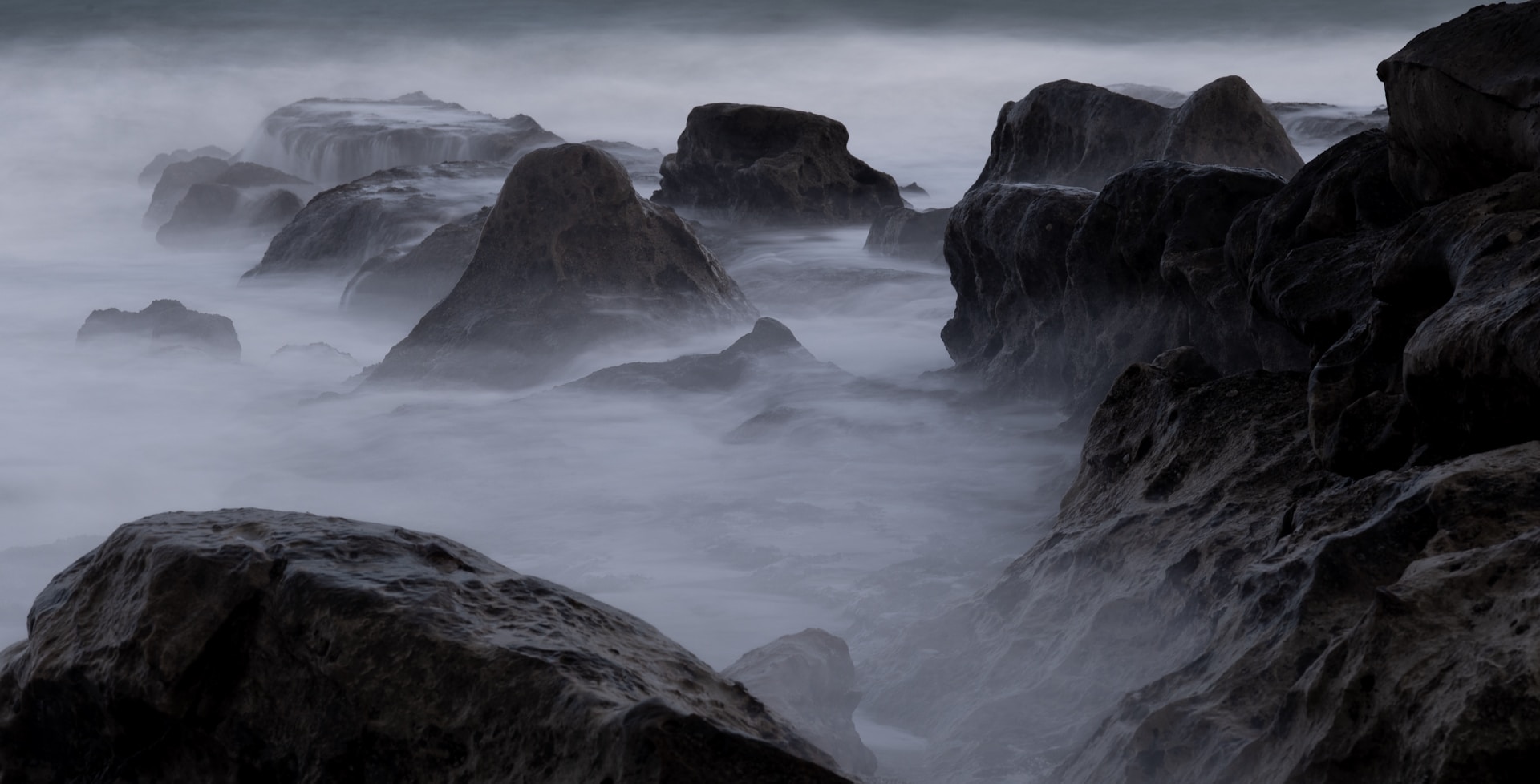 stone formations during foggy daytime