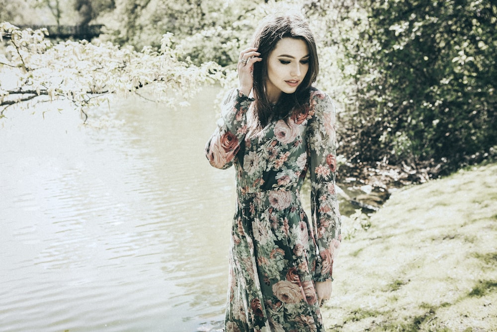 woman standing near body of water