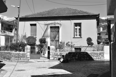 Traditional stone-built terraced house on a quiet street.
