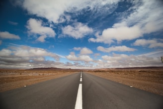 asphalt road under clear blue sky
