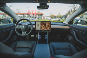 BYD electric vehicle dashboard displaying futuristic controls in a minimalistic setting.