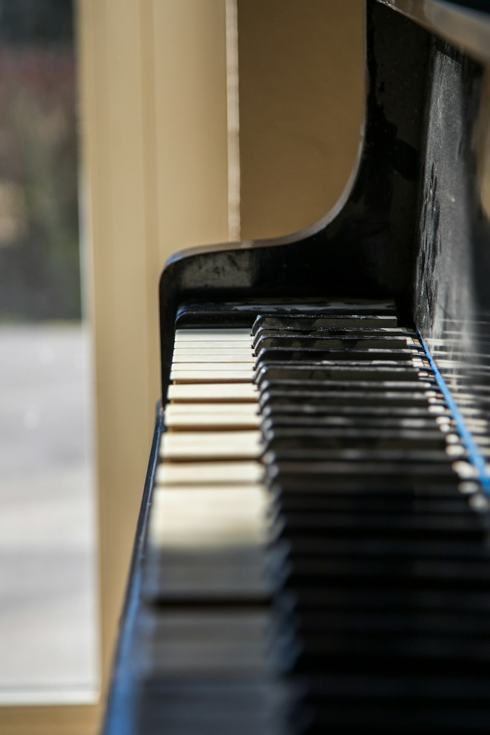 selective focus photography of black piano