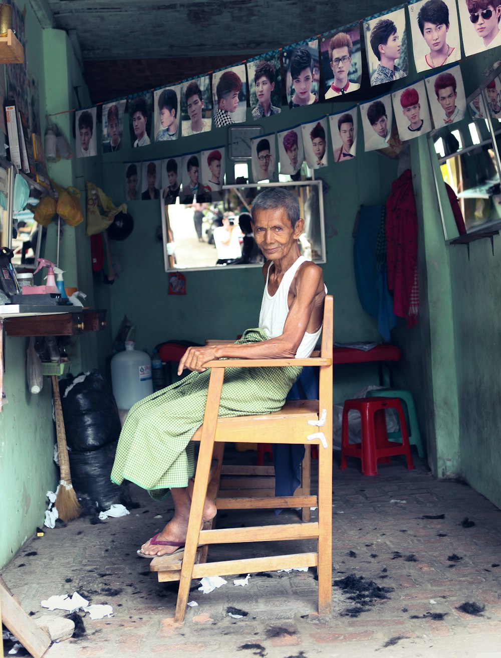 man sitting on brown chair