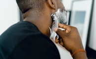 man shaving himself