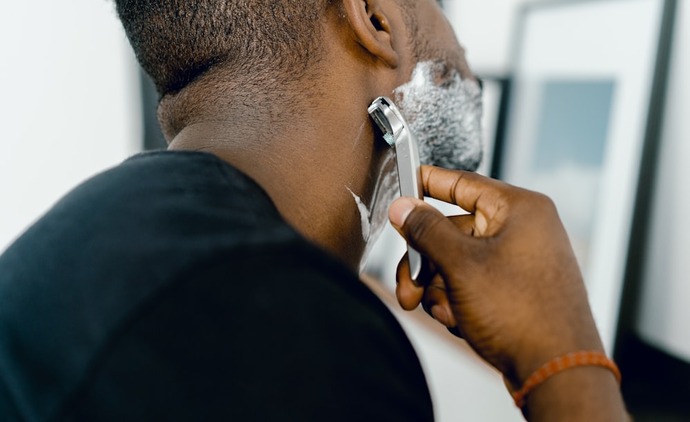 man shaving himself