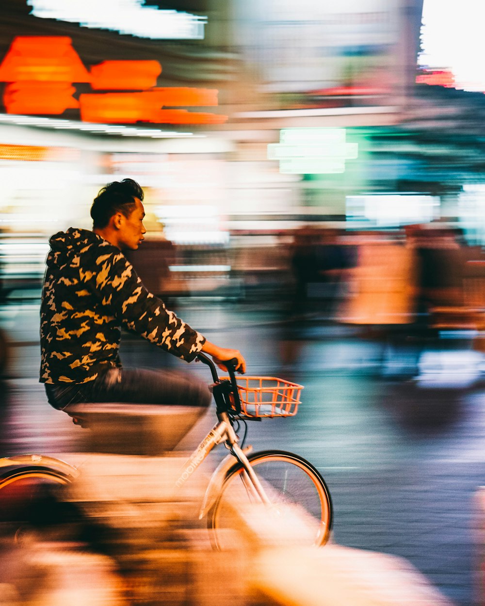 man riding on bike during daytime