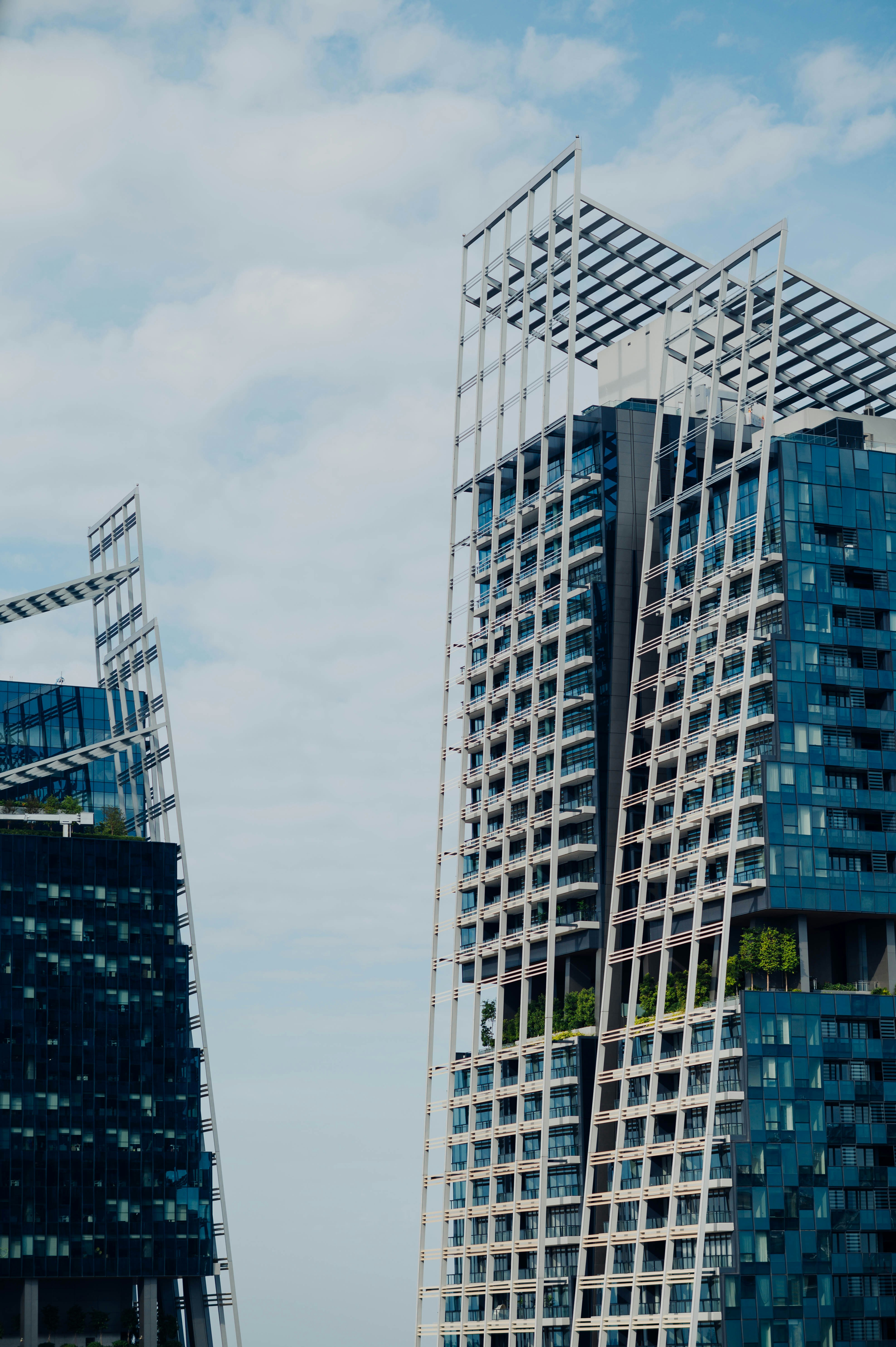 gray concrete buildings under white clouds during daytime