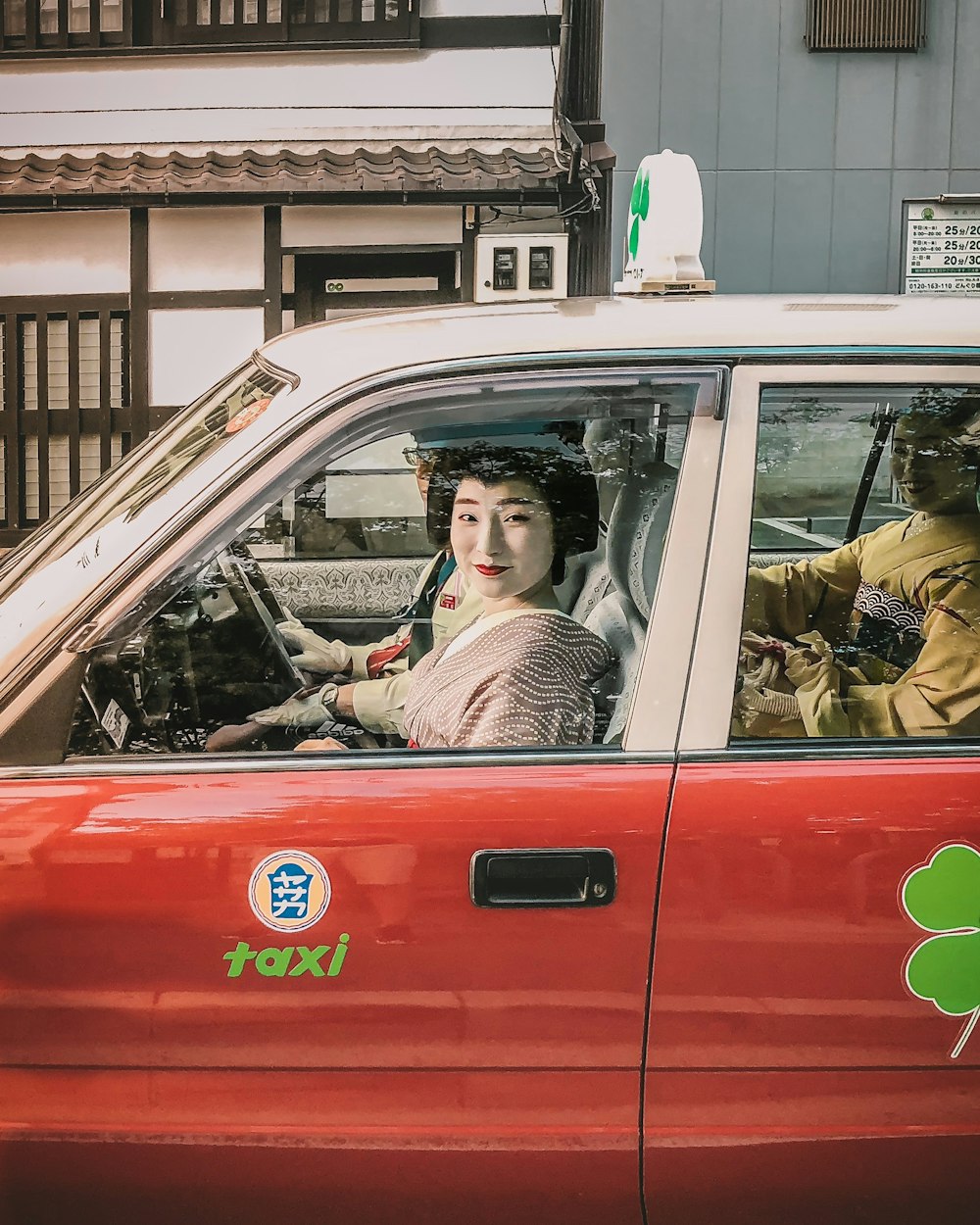 Geisha driving taxi