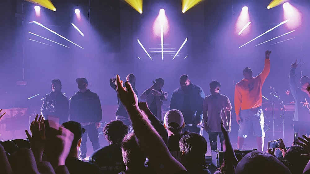 group of people singing on the stage