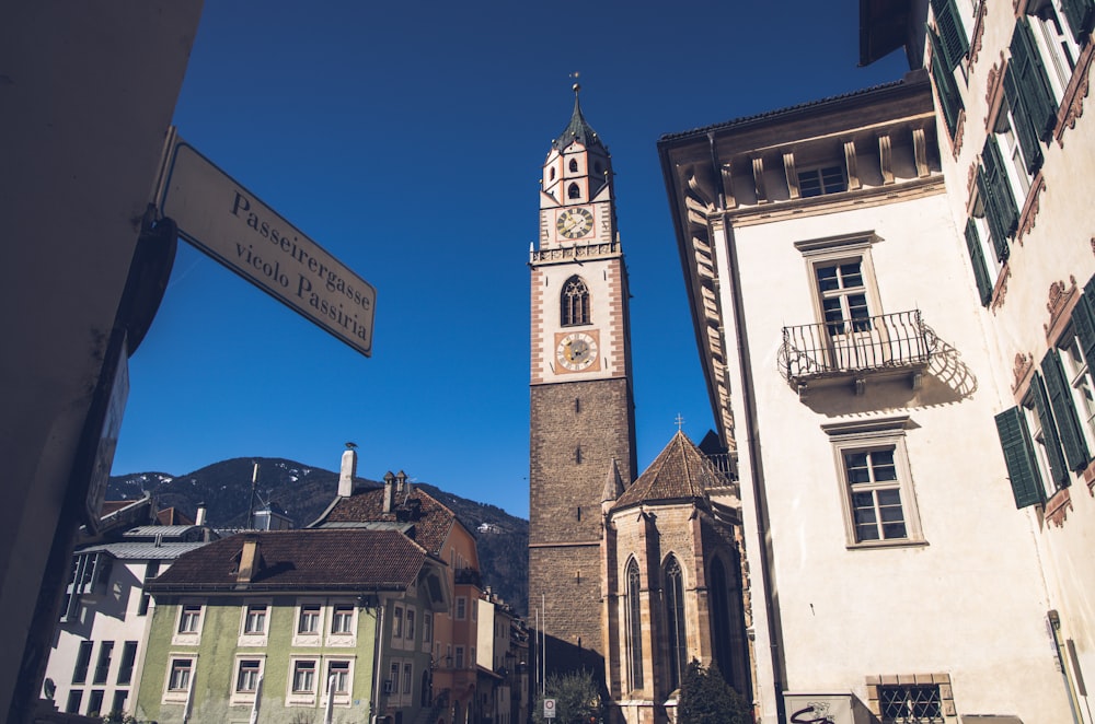 brown concrete tower clock during daytime