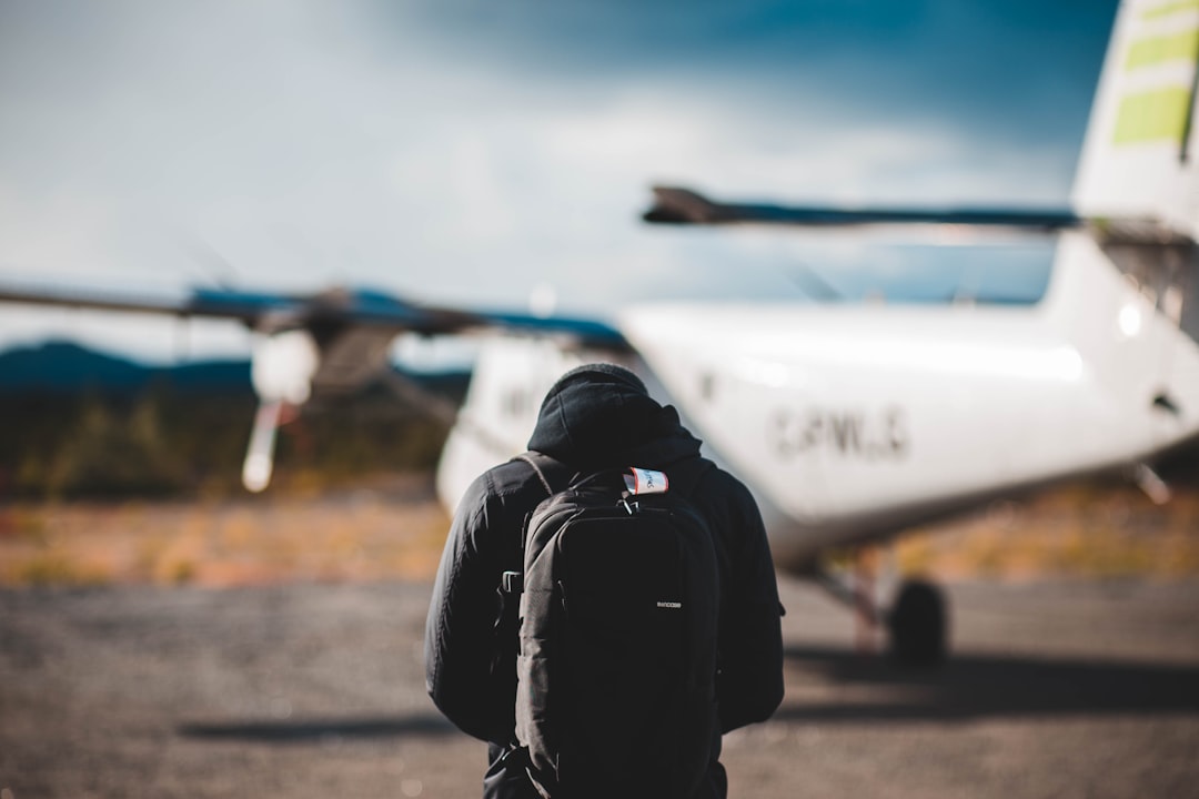 selective focus photography of man wearing hooded jacket