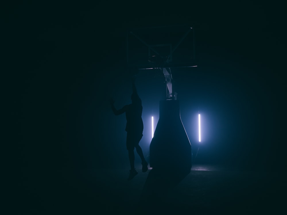 man jumping inside dimmed room