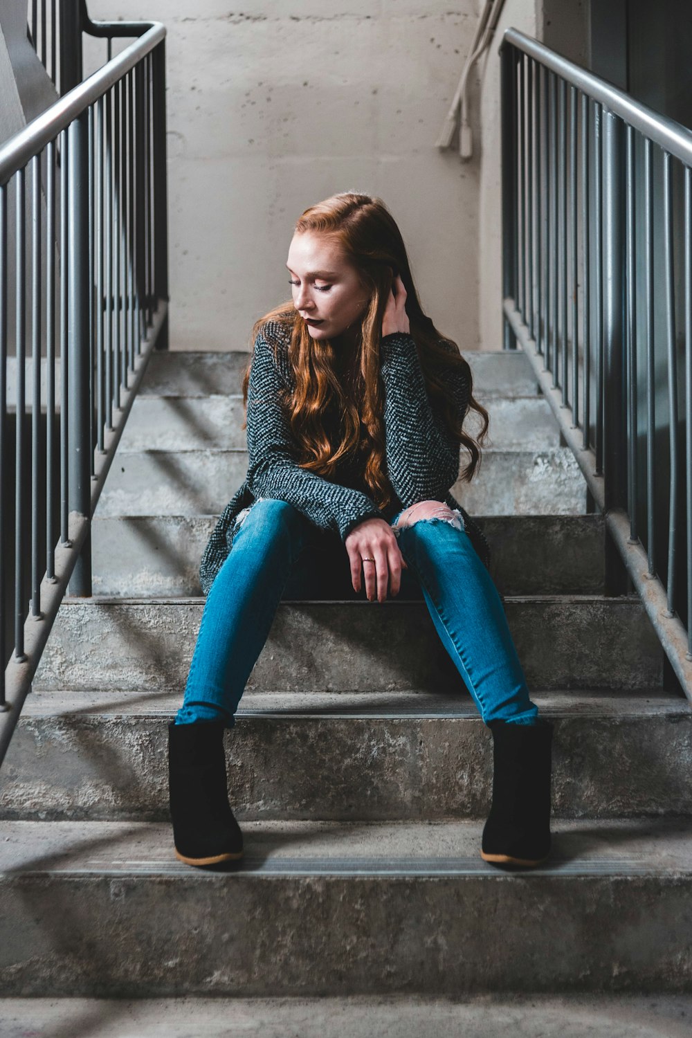 woman sitting on stair