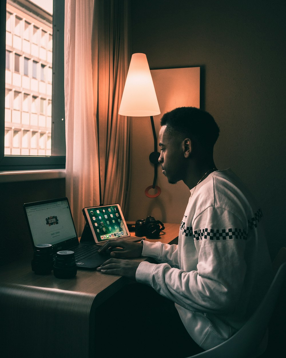 man using laptop inside room